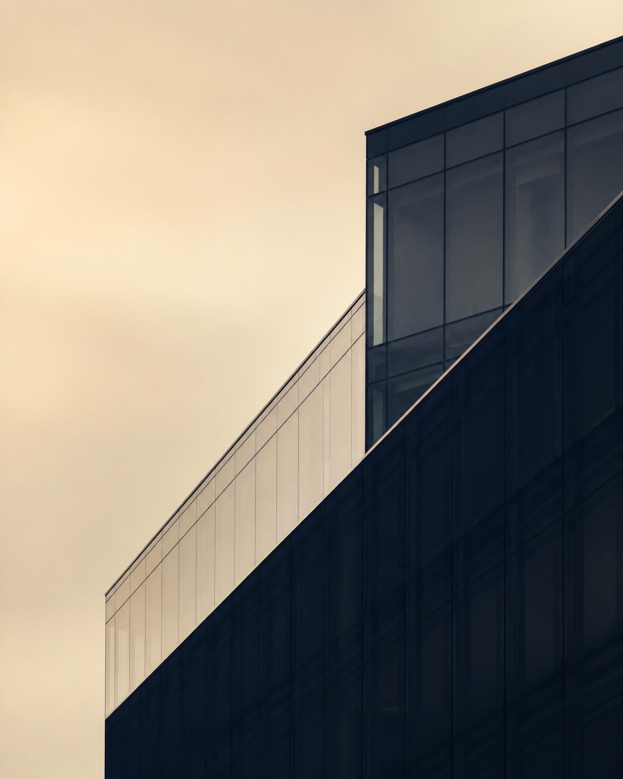 Modern glass office facade representing the industries Scale Shift invests in